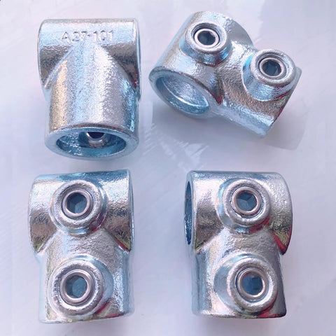 Four 3/4 inch galvanized pipe fittings single socket tee 90-degree connectors for DIY projects like handrails and shelving
