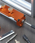 Effortless Aluminum Extrusion Drill Jig For Straight Up Precision Tapping And Metal Projects Quick Setup With Universal Fit, showcasing orange jig with steel guides.