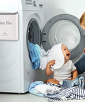 Lint Bin With Lid For Laundry Room, Small Magnetic Wall Mount Trash Can on dryer next to child and parent in warm white laundry area