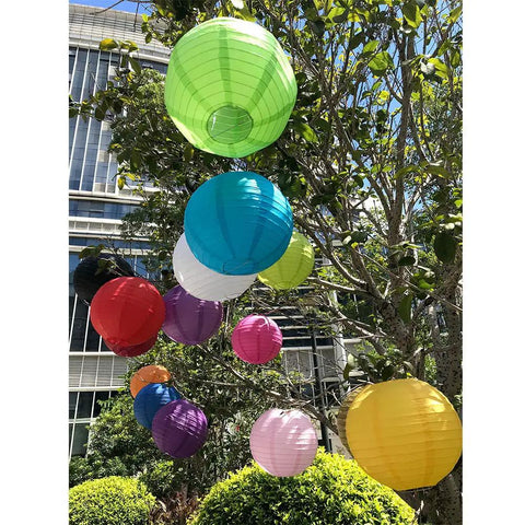 Colorful paper lanterns hanging in a garden, showcasing Six Inch White Paper Lanterns Set Of Six Hanging Round Lanterns For Birthday Party Wedding Christmas Bridal Home Decor Chinese Japanese Style Easy To Hang And Reusable.
