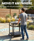 Person moving 35-Inch Outdoor Grill Cart With Stainless Steel Sink, Rolling BBQ Prep Table With Faucet, patio background
