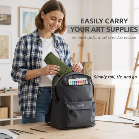 Woman placing 30 Slot Roll Up Paint Brush Holder, Premium Canvas Brush Organizer For Artists, Army Green into backpack