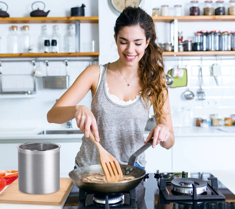 Woman cooking in kitchen near Stainless Steel Jumbo Grease Container With Removable Strainer And Snug Lid For Fryer Oil Bacon Drippings