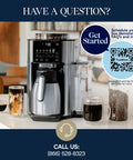 TrueBrew Drip Coffee Maker With Built-In Grinder And Bean Extract Technology, brews coffee into glass cups, 40 oz carafe visible.