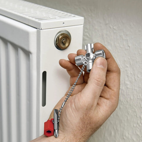 All-in-One Universal Control Cabinet Key for Gas, Water and Electric Shutoffs near a radiator knob