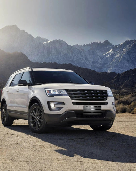 SUV with American Flag Front Bumper License Plate With 3D Embossed Patriot Design in mountain landscape