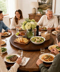 Top Shelf Walnut Lazy Susan Turntable 35.5 Inch Oversized Counter Rotating Tray With No Sweat 360 Spin Base, hosting family dinner.