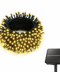 Coiled 5ft Outdoor Solar String Lights with 30 warm white LEDs and solar panel, waterproof, ideal for patios and gardens.