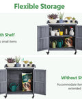 Mobile Outdoor Potting Bench Table With Castors On Wheels Solid Wood Workstation And Large Storage Cabinet Durable Metal Top Garden Station For Potting DIY Projects Flower Arranging And More Gray featuring flexible storage options, with open cabinet doors showing multiple gardening tools and pots.