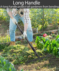 Heavy Duty Metal Garden Rake With 17 Prongs, 17 Inch Wide And 50 Inch Long Handle, Rustproof And Skidproof in use in a garden