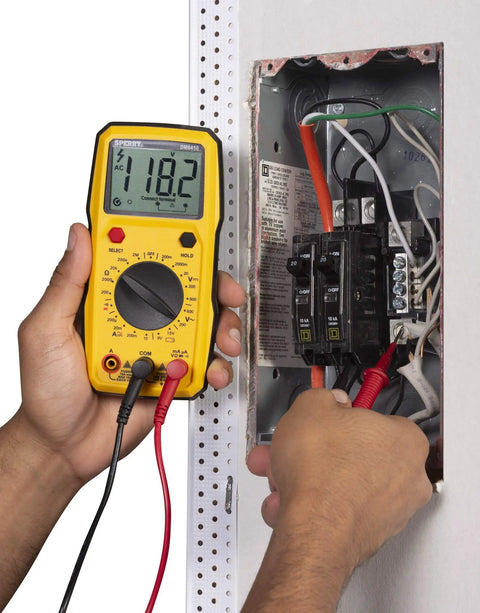 Person using Dm6410 8 Function Digital Multimeter With Large LCD Display And Data Hold For Accurate AC DC Voltage And Current Measurements Yellow Pro Grade Tool For Electricians on electrical panel.