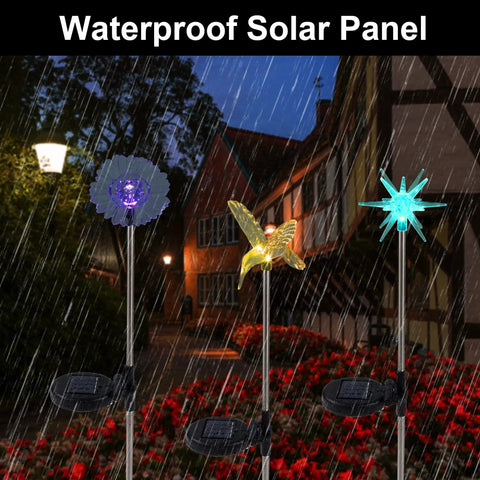 Six Pack Solar Garden Stake Lights Set With Color Changing LED Figurines Including Butterfly in rainy garden scene