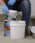 Anti-Skid Additive With Aluminum Oxide Formula To Boost Slip Resistance In Epoxy Latex Or Oil-Based Paints And Stains, 3.4 oz poured into a white mixing bucket.