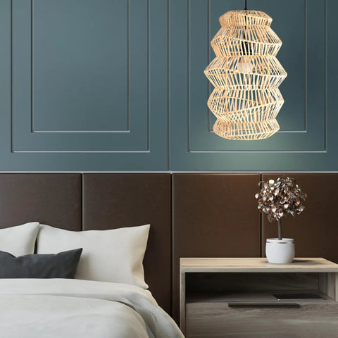 FOREVER BAMBOO Handwoven Indonesian Bamboo Pendant Light, 18 in H x 12 in W hangs above a modern bed in a stylish room.