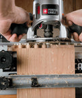 Close-up of Deluxe 12 Inch Dovetail Jig For Woodworking And Cabinet Making Pro Grade Router Jig Kit in use with wood.