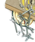 Quarter Inch Twenty Wing Nut And Wing Bolt Fastener Kit With Hand Tighten Wing Head Zinc Plated Hardware scattered on books