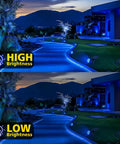 Blue Solar Spotlight Outdoor Lights illuminating a garden pathway at night with high and low brightness settings visible.