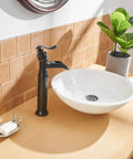 Oil Rubbed Bronze Vessel Sink Faucet With Waterfall Flow Tall One Hole Deck Mount Single Handle Vanity Faucet Includes Faucet Supply Hose Heavy Duty Solid Brass Construction Ceramic Cartridge For Leak Free Performance in modern bathroom.