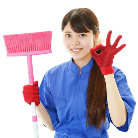 Person in blue uniform holding a pink broom and making an OK sign, related to Ten Pack Wall Mount Organizing Spring Clamps For Tools, Rakes And Brooms With Handy Multi Tool Holder For Garage Or Shop Storage And Grab And Go Access Anywhere.