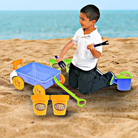 Child playing on a beach with Garden Wagon And Tools Toy Set For Kids 15 Pcs Outdoor Sand Beach Play Set Toddlers 1 3.