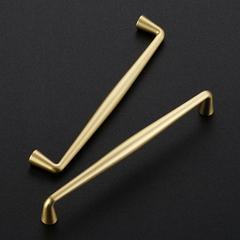 Kickass Brushed Gold Cabinet Handles And Drawer Pulls Made From Solid Zinc Alloy Heavy Duty Build Smooth Finish And No Drama Installation For Kitchens In Six Quarter Inch Pack Of Twenty Pieces, showing two stylish handles on dark surface.