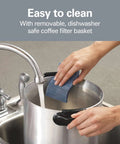 Person cleaning 45 Cup Fast Brew Coffee Urn And Hot Beverage Dispenser Great For Large Crowds Keeps Coffee Hot And Ready Brews 15 To 45 Cups In About 28 Minutes Perfect For Offices Events And Big Gatherings in sink with sponge