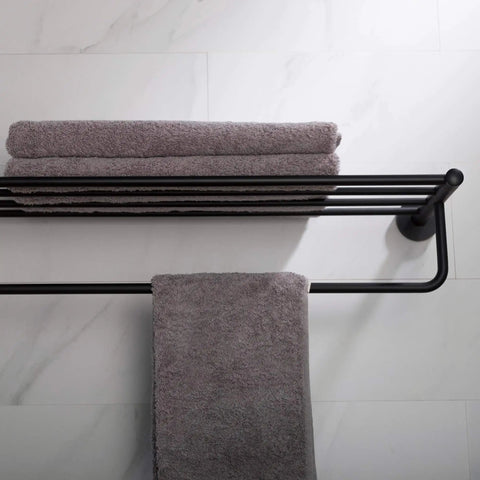 Elie Matte Black Bathroom Shelf With Towel Bar Built Tough From Solid Brass holding folded towels, wall-mounted