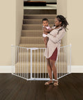 Extra Wide Baby Gate With Door Kid Safe For Stairs And Hallways Hardware Mounted installed at bottom of carpeted staircase