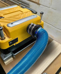 4 Inch Dust Collection Flex Cuff With Stainless Steel Hose Clamps For An Airtight Seal connected to woodworking tool