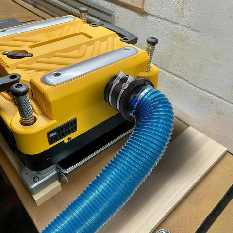 4 Inch Dust Collection Flex Cuff With Stainless Steel Hose Clamps For An Airtight Seal connected to woodworking tool