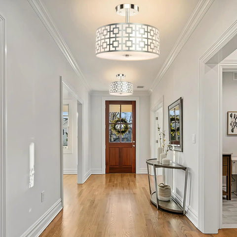 Three Light Flush Mount Ceiling Light In Brushed Nickel With A Modern Drum Design And Double Shade in a hallway setting