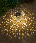 2 Pack Outdoor Solar Lanterns With Hanging Lights Waterproof Metal Sun Moon Star Pattern In Gold Finish on patio displaying light pattern