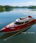 Fast 19 Inch RC Boat With 35 Plus KPH Top Speed Remote Control Water Toy For Kids And Adults on a lake with size dimensions shown