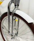 26 Inch Springer Fork For Cruiser Bicycles With Dual Spring Suspension, 1 Inch Threaded Steering, Chrome Finish visible on bike wheel