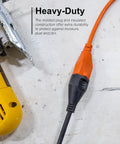 Heavy duty extension cord connected to power tool, showing orange Outdoor Extension Cord 80 Ft Heavy Duty 16 Gauge 3 Prong Grounded ETL Listed.