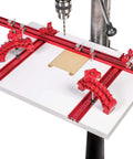 Knockout Rock Solid Micro Dot Drill Press Table Kit With Tight 36 Inch Fence, features red clamps and smooth surface for drilling.