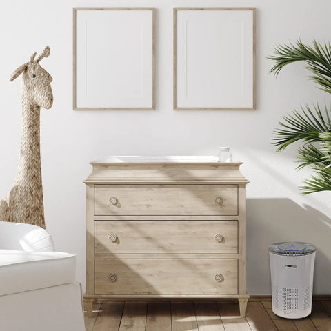 Premium Hepa Air Purifier With H13 True Filters And Uv Light Plus Activated Carbon next to a wooden dresser in a bright room.