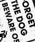 Hella Durable Metal Wall Art Sign For The Man Cave Featuring Funny Forget The Dog Beware Of Wife Quote In Rust Proof Aluminum Garage Decor That Is Legit Tough And Totally Bro Approved 12 By 8 Inch, showing playful warning detail with raindrops.