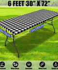 Waterproof Elastic Fitted 6Ft Picnic Table Cloth 2 Pack Buffalo Plaid Black White 30x72 Inches outdoors on grass