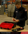 Man assembling OSHA Compliant Lockout Tagout Kit With 85 LOTO Devices And Durable Toolbox on workbench