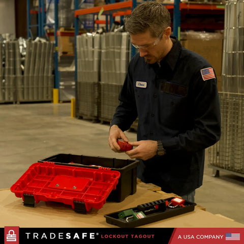 Man assembling OSHA Compliant Lockout Tagout Kit With 85 LOTO Devices And Durable Toolbox on workbench