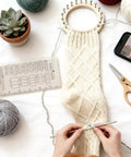 Super Crisp Acrylic Gauge Ruler For Knitting And Crochet No Sweat Stitch Measurement Guide With Transparent Grid on workspace.