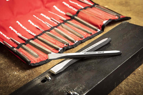 12 Piece Punch And Chisel Chrome Set For Pros And DIYers, close-up of chisels with durable chrome finish on a textured surface.