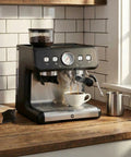 Level Up Your Coffee Game With This Badass 20 Bar Espresso Maker Featuring A Built In Grinder, Stainless Steel Body, Huge 2.8 Liter Tank, And Steam Wand For Flawless Lattes And Cappuccinos, Black on a wooden kitchen countertop.