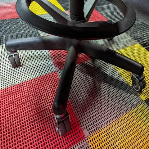 Set Of Five 2 Inch Swivel Caster Wheels Featuring M10 X 25mm Threaded Stem For Fast Office Chair Replacement on a colorful floor.