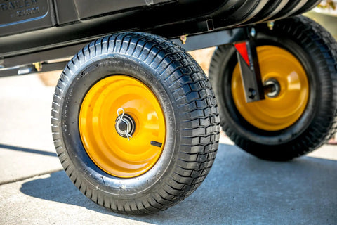 Heavy Duty Lawn Trailer With 600 Lb Capacity, 10 Cu Ft Poly Tub, yellow wheels on rugged all-steel frame, close-up view