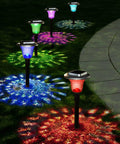 Solar Outdoor Path Lights 6 Pack With Lit Color Changing And Static Warm Glow Modes illuminating garden path at night