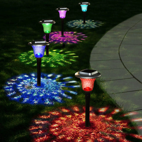 Solar Outdoor Path Lights 6 Pack With Lit Color Changing And Static Warm Glow Modes illuminating garden path at night