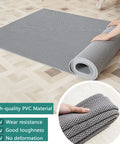 Commercial Drainage Mat 3x10 Ft 0.22 Inch Thick Grippy Non Slip PVC Floor Rug For Restaurant Kitchen Bar Patio Bathroom Wet Areas Gray Durable Easy Drying Heavy Duty Water Drain Mat being unrolled on floor