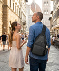 Man walking with Men's Sling Bag Crossbody Backpack, Compact Yet Roomy Small Sling Pack For Everyday Carry in city setting